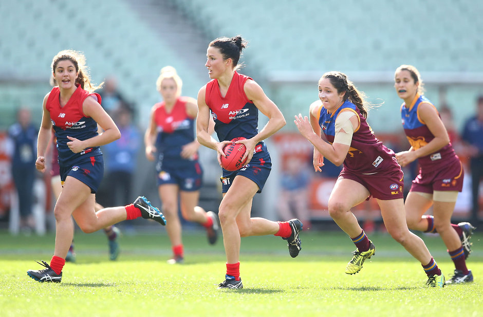 AFL 2016 Womens - Melbourne v Brisbane MELBOURNE, AUSTRALIA - MAY 22: Melissa Hickey of Melbourne runs with the ball during the 2016 AFL Womens match between the Melbourne Demons and the Brisbane Lions at the Melbourne Cricket Ground on May 22, 2016 in Melbourne, Australia. (Photo by Scott Barbour/AFL Media)